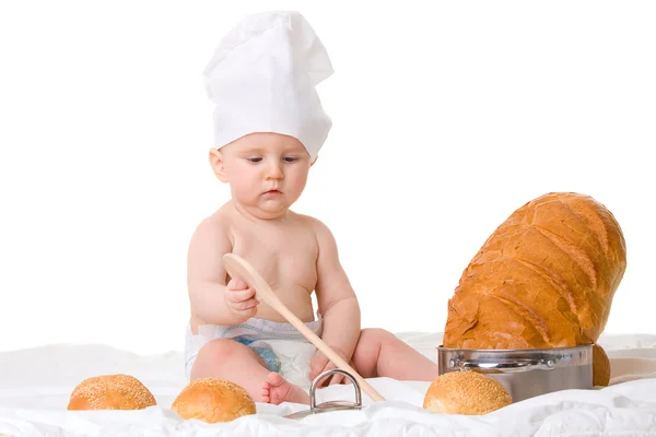 Kleine jongen chef-kok met lepel — Stockfoto