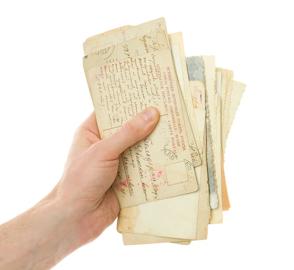 Mano con tarjeta postal de escritura antigua aislada en blanco —  Fotos de Stock