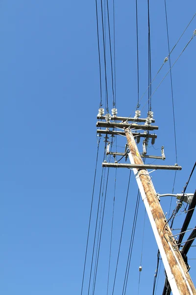 stock image Telegraph pole over blue sky