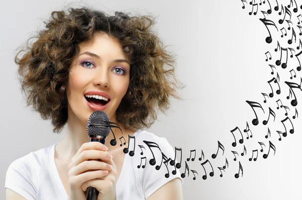 Singing into a microphone — Stock Photo, Image