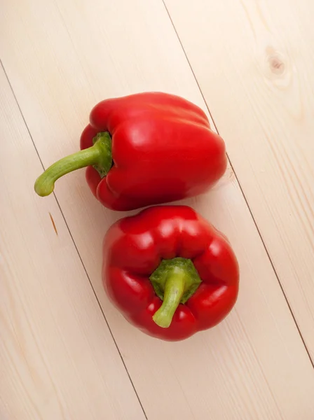 Red pepper on wood floor — Stock Photo, Image
