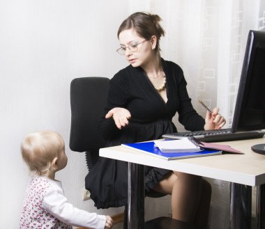 Busy mother with her baby clipart