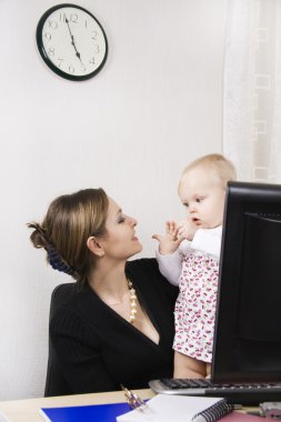 Busy mother with her baby clipart