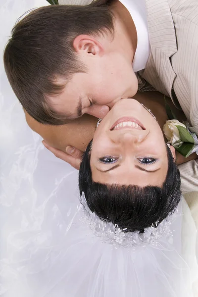 Loving groom and beautiful bride are happy together. — Stock Photo, Image
