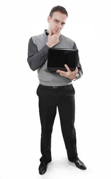 Empresario serio y pensante con portátil en las manos — Foto de Stock
