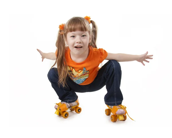 The little girl on roller skates — Zdjęcie stockowe