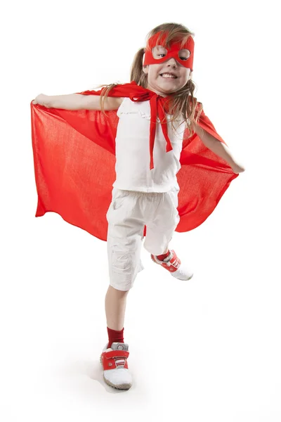 Menina super-herói em um vermelho — Fotografia de Stock