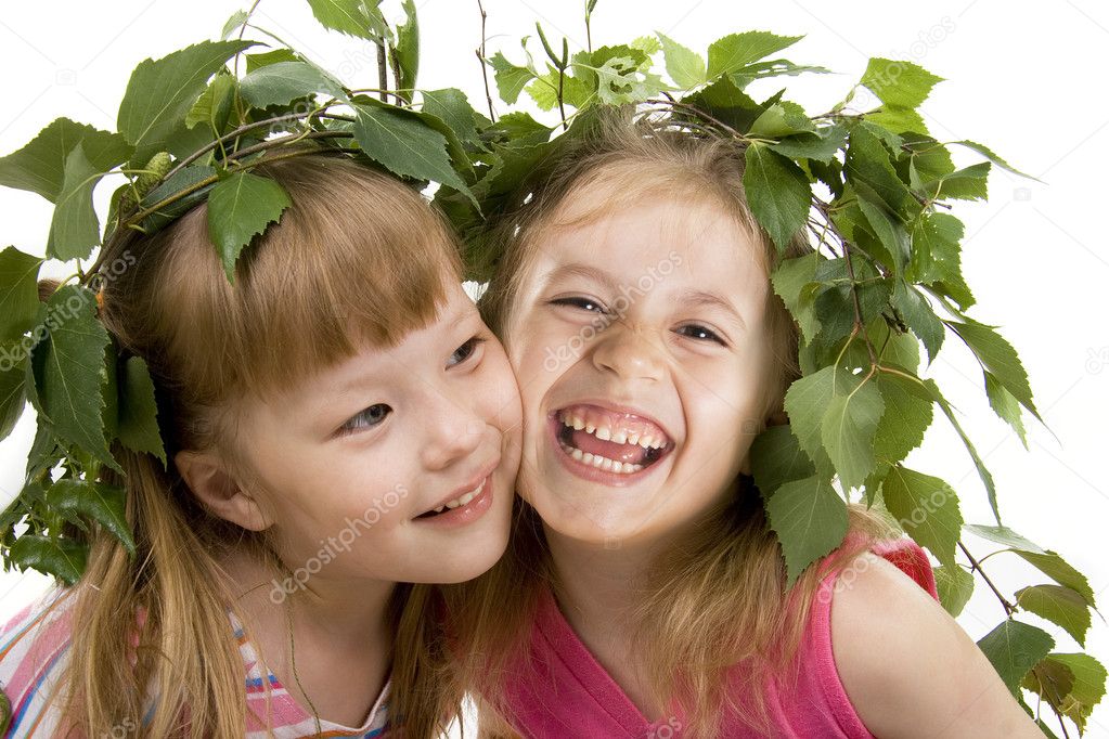 Two cheerful little girls of the friend on a white background