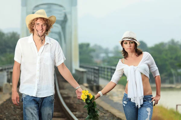 Couple on train tracks — Stock Photo, Image
