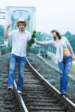 Couple on train tracks clipart