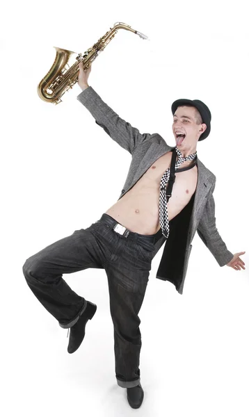 The young jazzman dancing with a saxophone — Stock Photo, Image