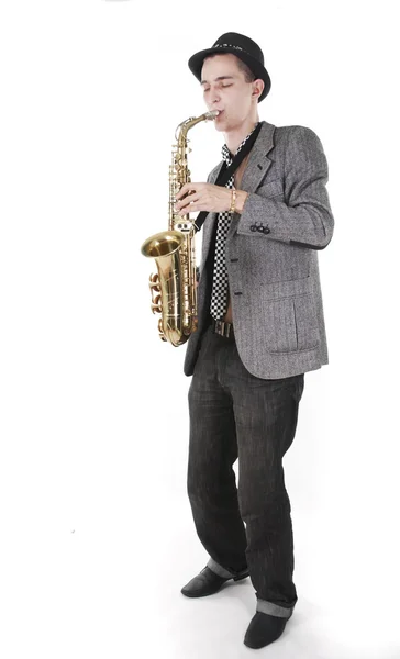 The young jazzman plays a saxophone — Stock Photo, Image