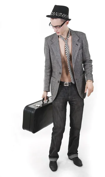 The vintage young man with a case looks aside — Stock Photo, Image