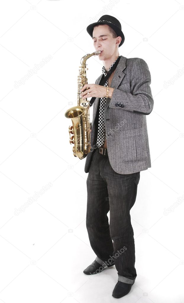 The young jazzman plays a saxophone