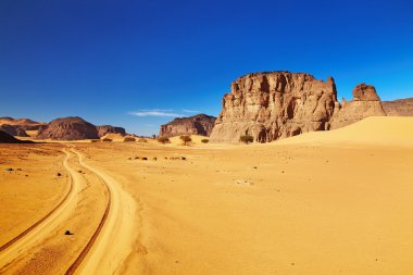 Desert landscape with rocks and blue sky, Tadrart, Algeria clipart