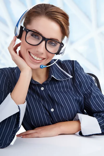 Stock image Support phone operator in headset at workplace