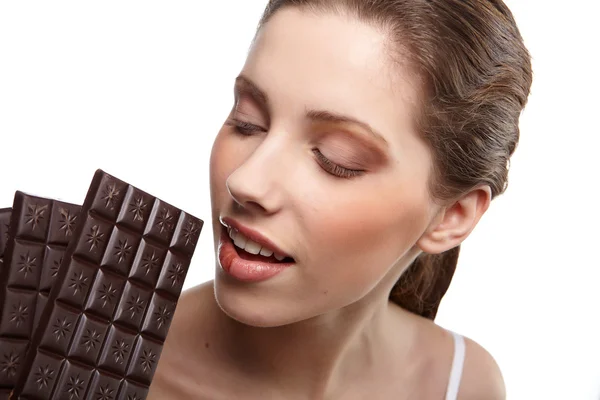 Portret van mooie vrouw met een chocolade — Stockfoto