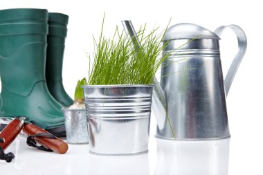 Garden boots with tool and watering clipart