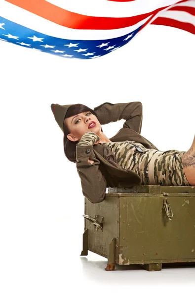 Young attractive girl dressed in old battle coat sitting . Vinta — Stock Photo, Image
