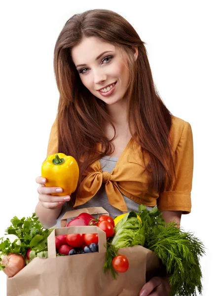 Vrouw met een zakhoogtepunt van gezond voedsel. winkelen . — Stockfoto