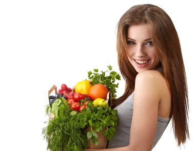 Woman holding a bag full of healthy food. shopping . clipart