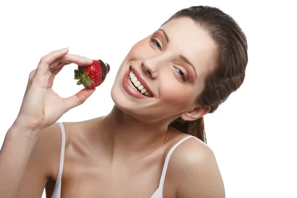 Portrait of lying down woman with a strawberry — Stock Photo, Image