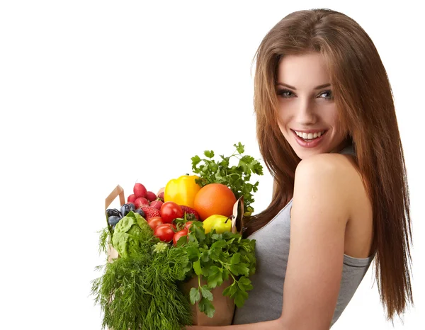 Woman holding a bag full of healthy food. shopping . Royalty Free Stock Photos