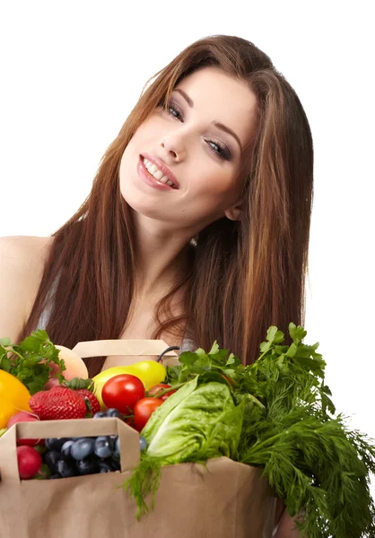 Woman holding a bag full of healthy food. shopping . Stock Photo