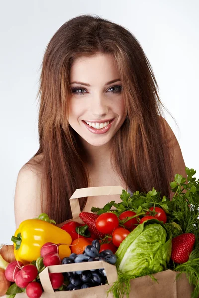 Woman holding a bag full of healthy food. shopping . Stock Picture