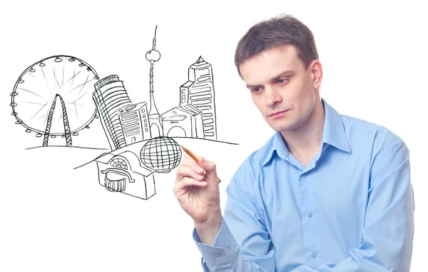 Businessman drawing a city — Stock Photo, Image