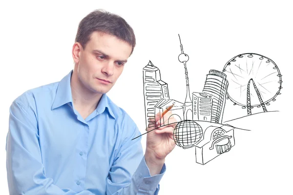 Businessman drawing a city of the future. — Stock Photo, Image
