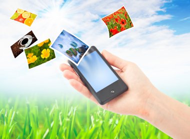 Mobile phone in hand clipart