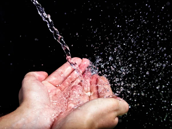 Hand och vatten — Stockfoto