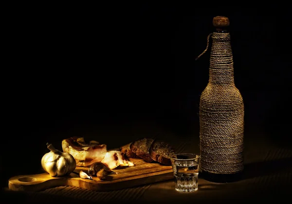 stock image Still-life with garlic, bacon and vodka