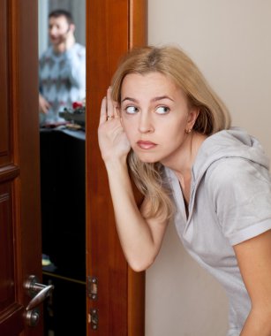 Jealous wife, overhearing a phone conversation her husband clipart