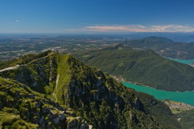 View from Monte Generoso down to Lugano and its lake in Switzerland clipart