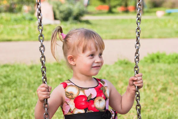 Girl on swings — Stock Photo, Image
