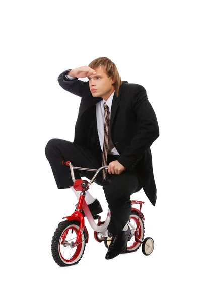 Empresário em bicicleta infantil — Fotografia de Stock