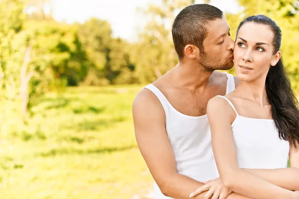 Man kisses in on cheek woman — Stock Photo, Image