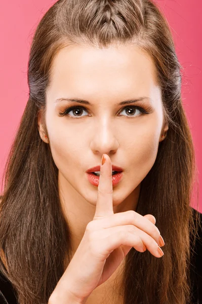 Beautiful brunette calls for silence — Stock Photo, Image