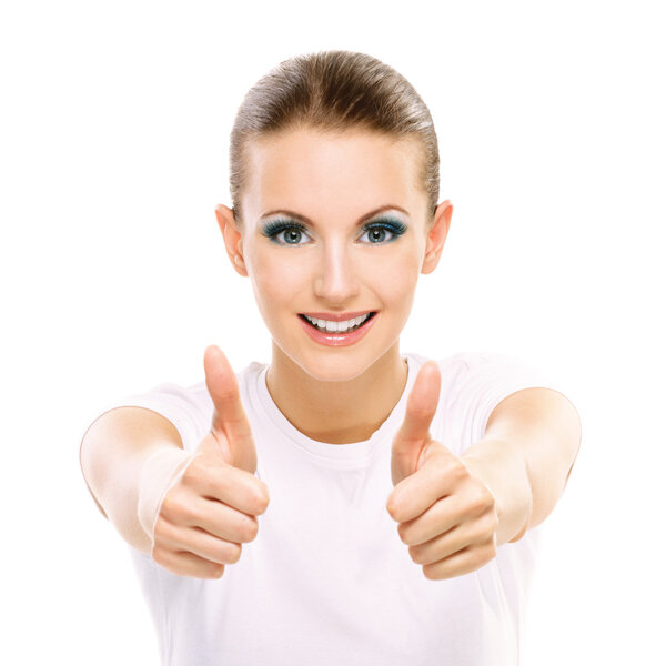 Charming dark-haired successful girl with thumbs up, on white background.