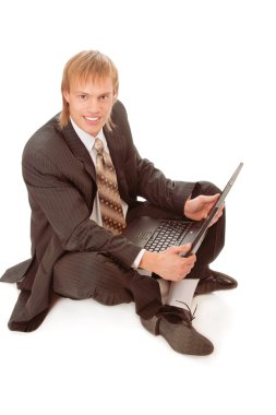Young businessman with laptop clipart