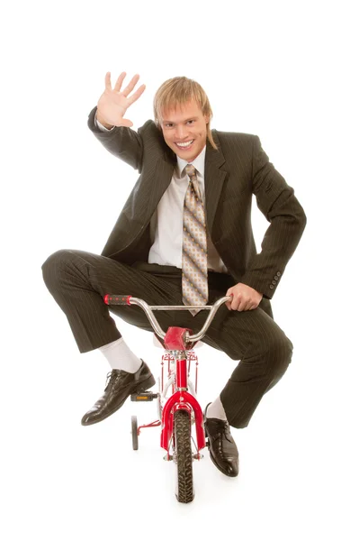 Empresário na bicicleta infantil — Fotografia de Stock