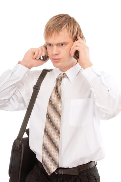 Homem falando em dois telefones celulares — Fotografia de Stock