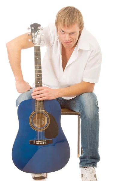 Young man with a guitar Stock Picture
