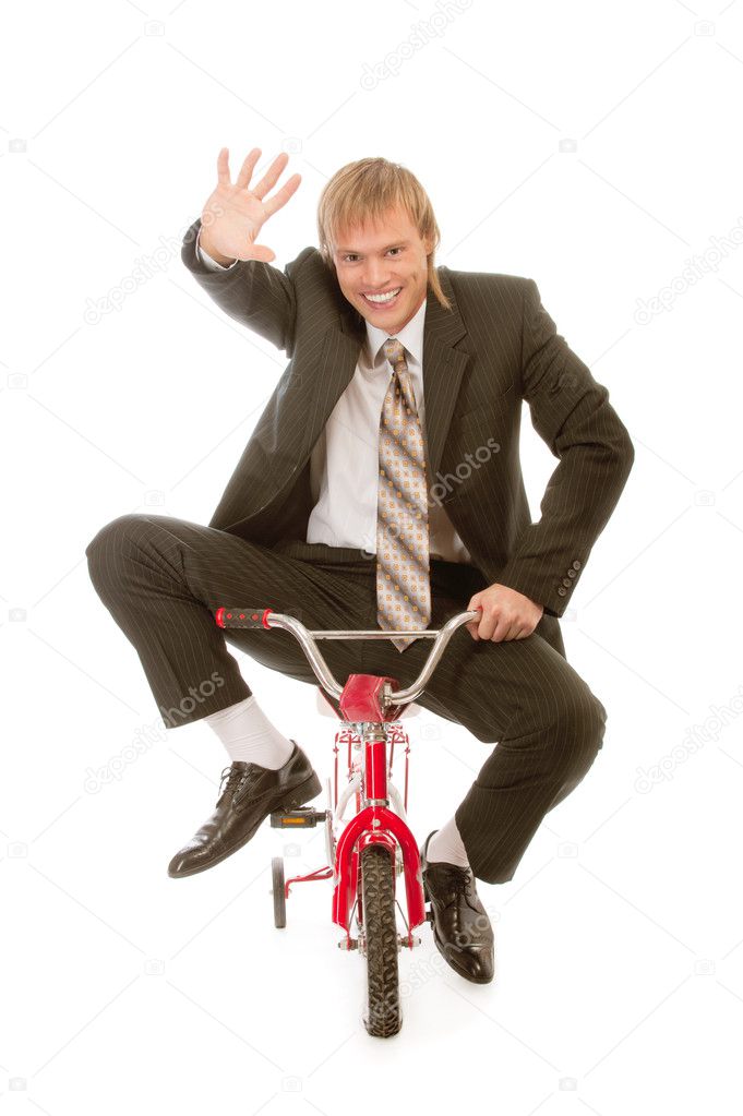 Businessman on children's bicycle