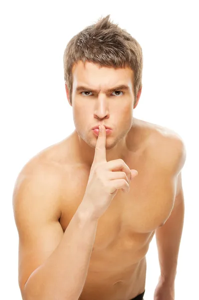 Muscular guy calls for silence — Stock Photo, Image