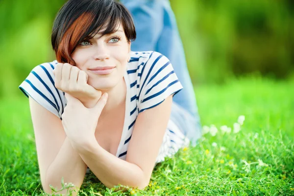 Girl lying on the grass — Stock Photo, Image