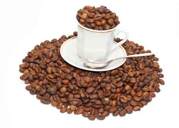 Copo com os calos de cafés e colher — Fotografia de Stock
