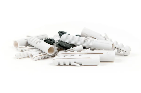 Heap of a plastic dowels on white background — Stock Photo, Image